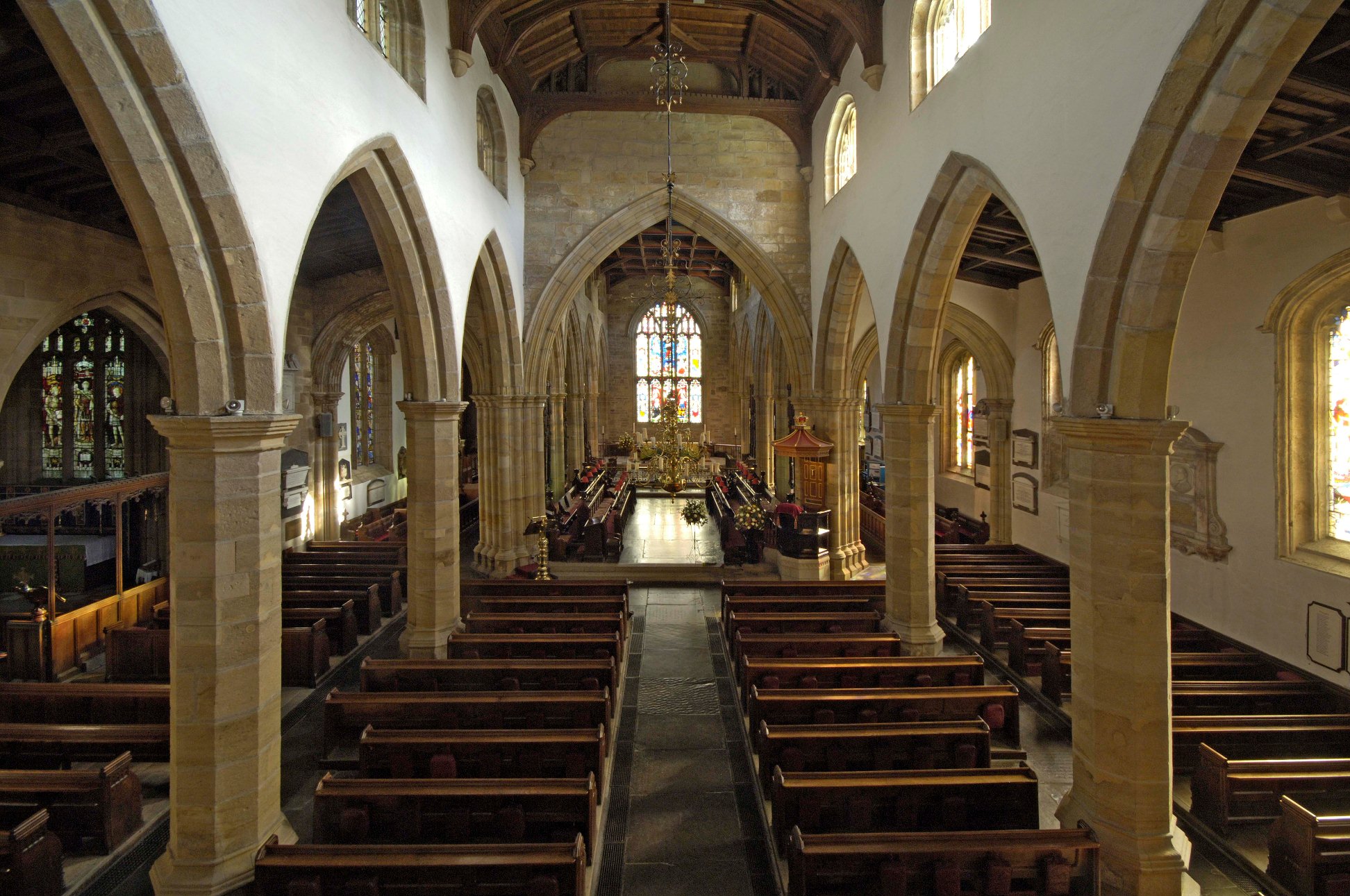 Interior of priory church, Lancaster, Lancashire showing arches of the 14th century aisle arcades