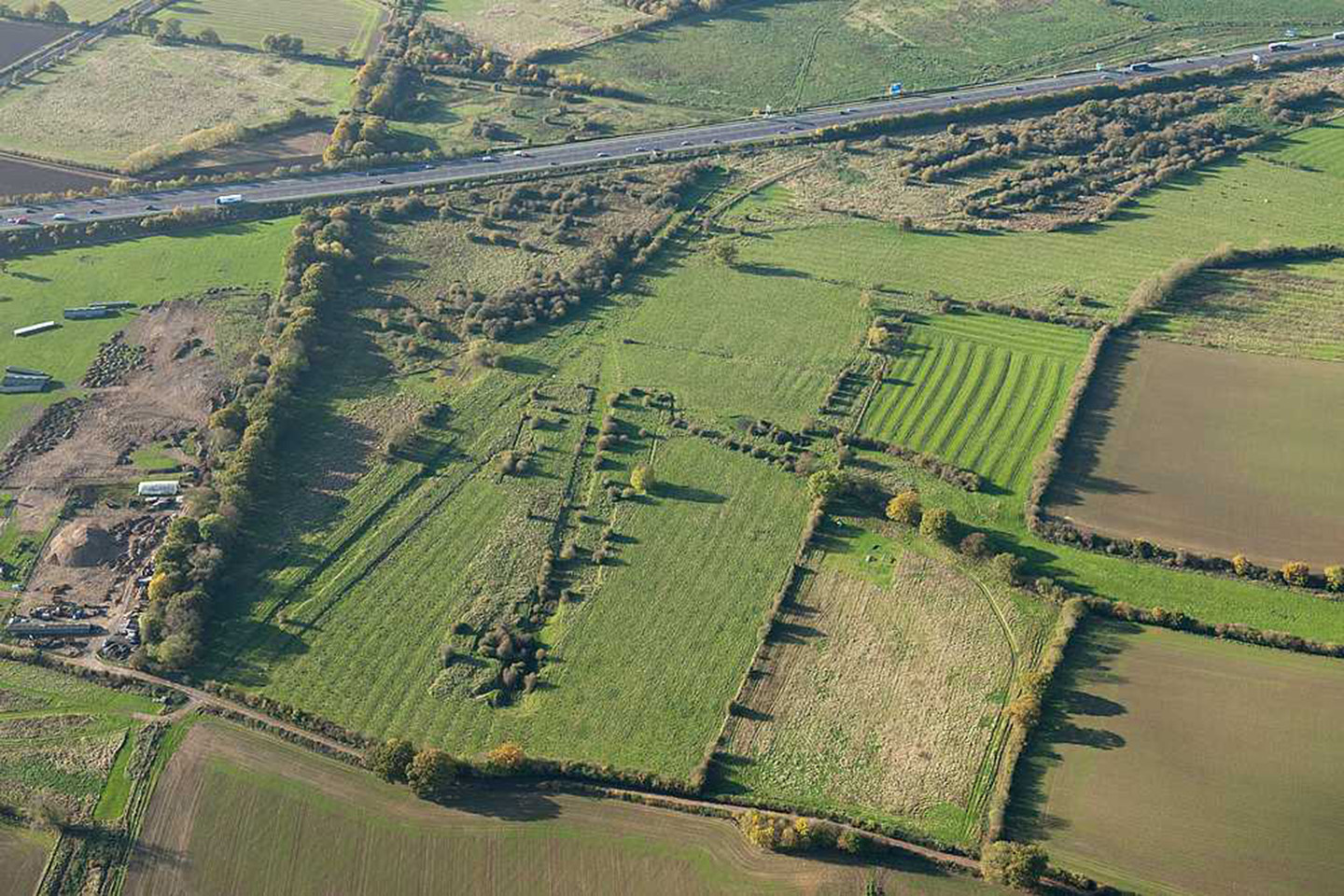 National Filling Factory Banbury, Northampton, aerial photograph showing the earthwork remains of the factory overlying traces of earlier ridge and furrow cultivation.