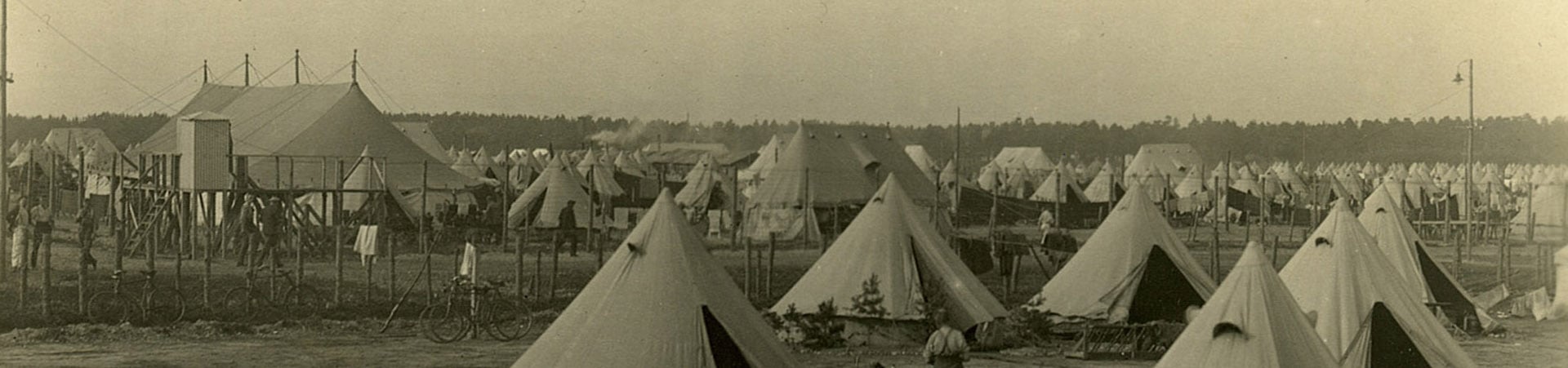 First World War Prisoner of War camp housed in canvas bell tents and large communal tents.