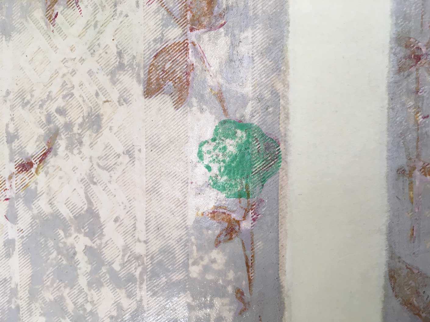 A historic wallpaper featuring geometric and floral patterns. The green pigment contains arsenic.