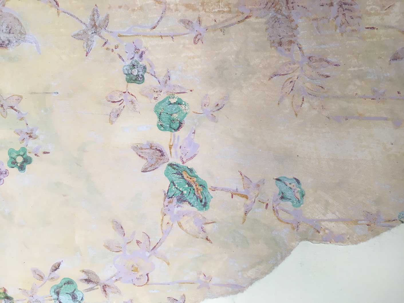 A historic wallpaper featuring a floral pattern with green flowers. The green pigment contains arsenic.