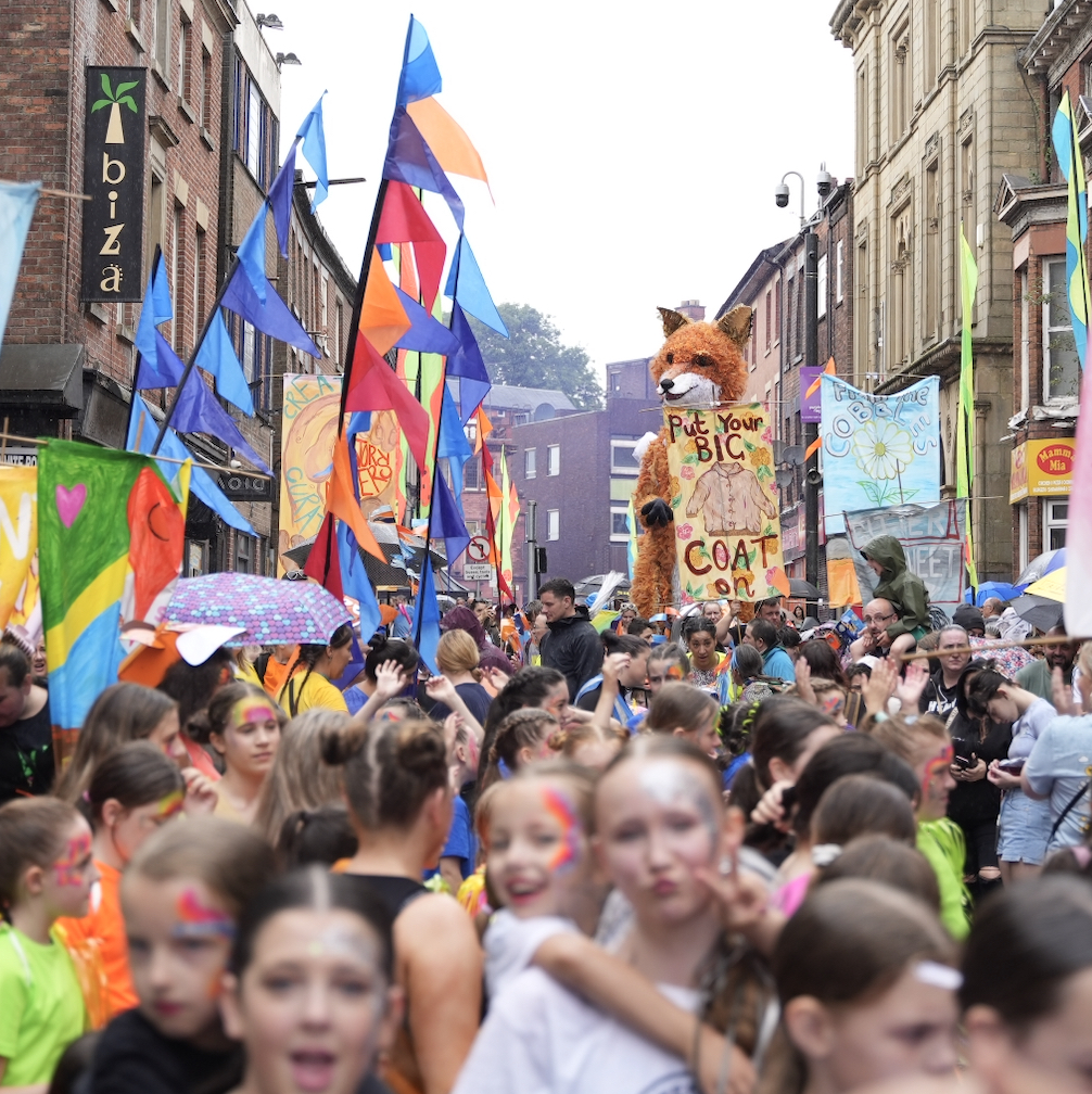 A crowd at a street carnival in Wigan.