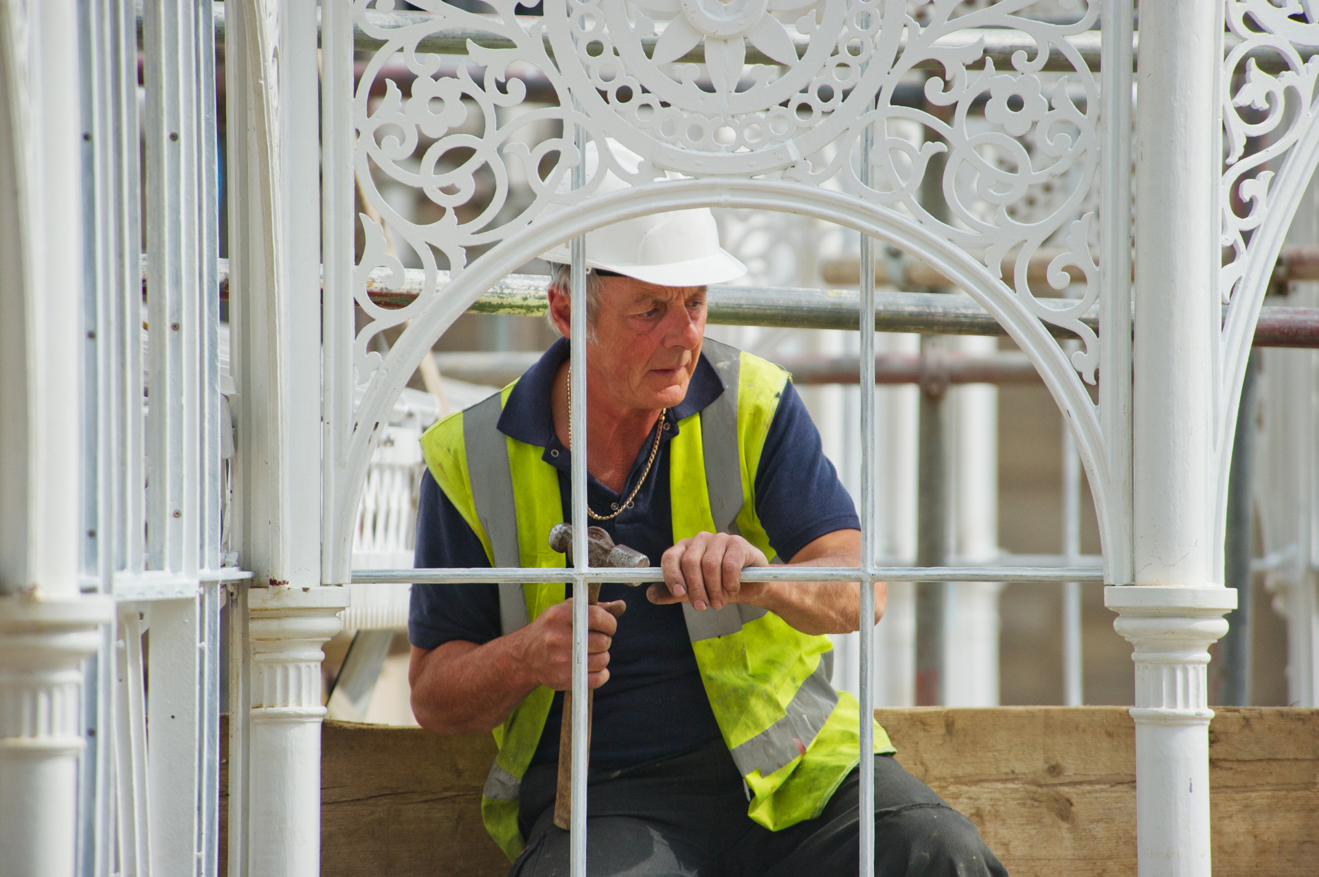 A worker renovating the greenhouse at Wentworth Castle.