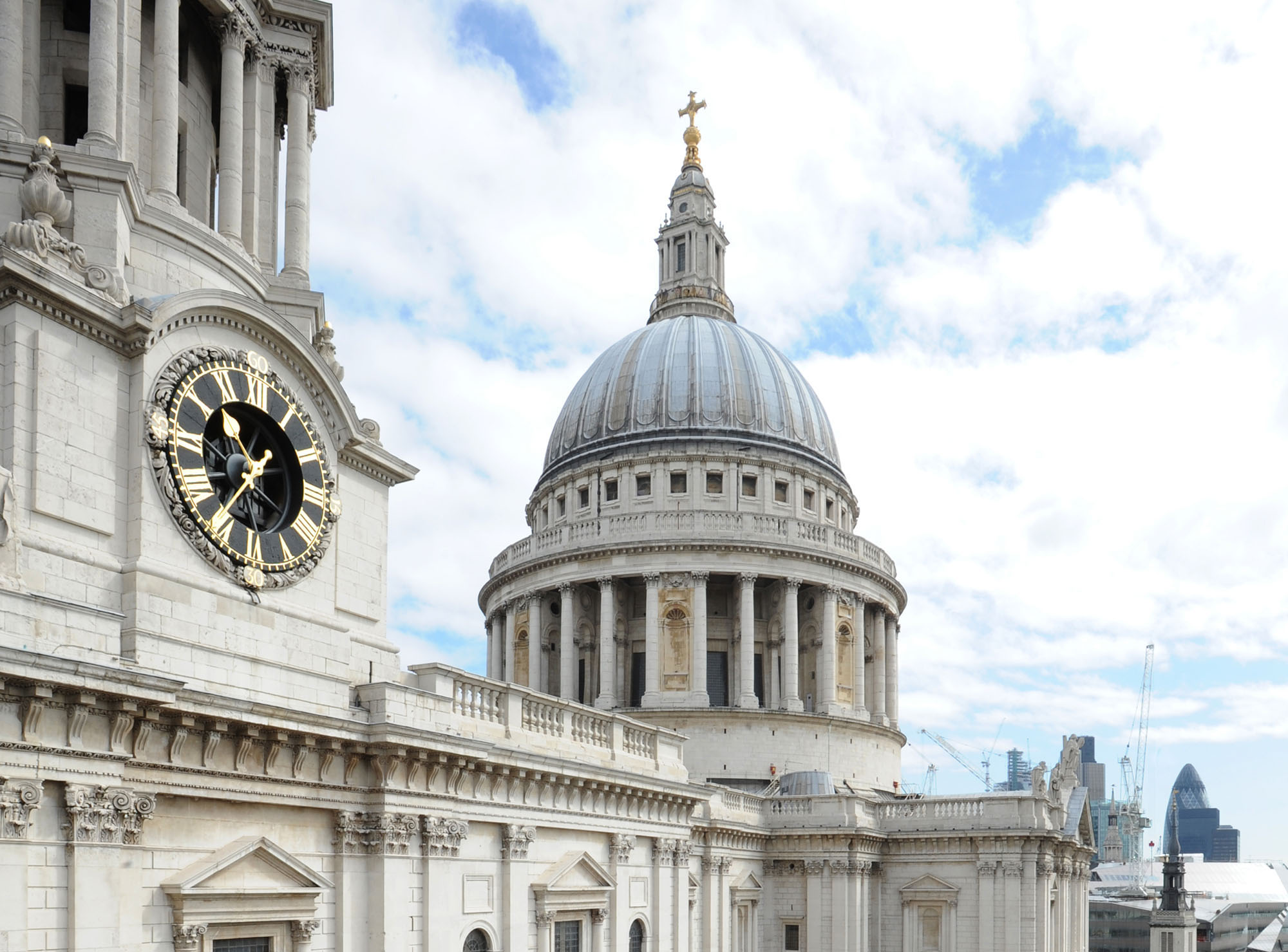 Dome of St Paul's Cathedral from the south with clock in foreground