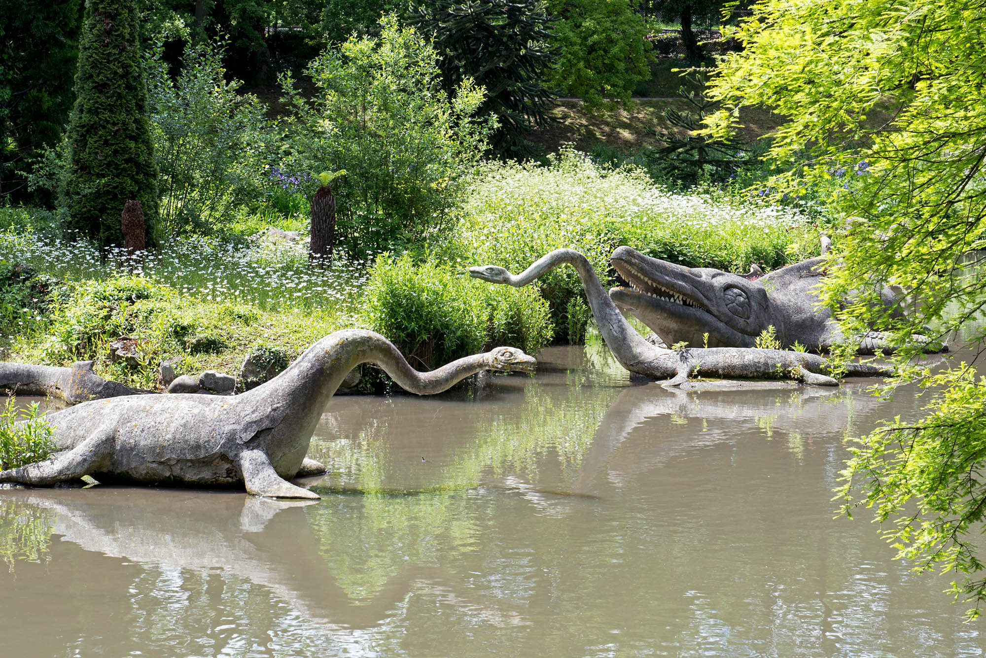 The dinosaur sculptures in the 'At Risk' Crystal Palace Park.