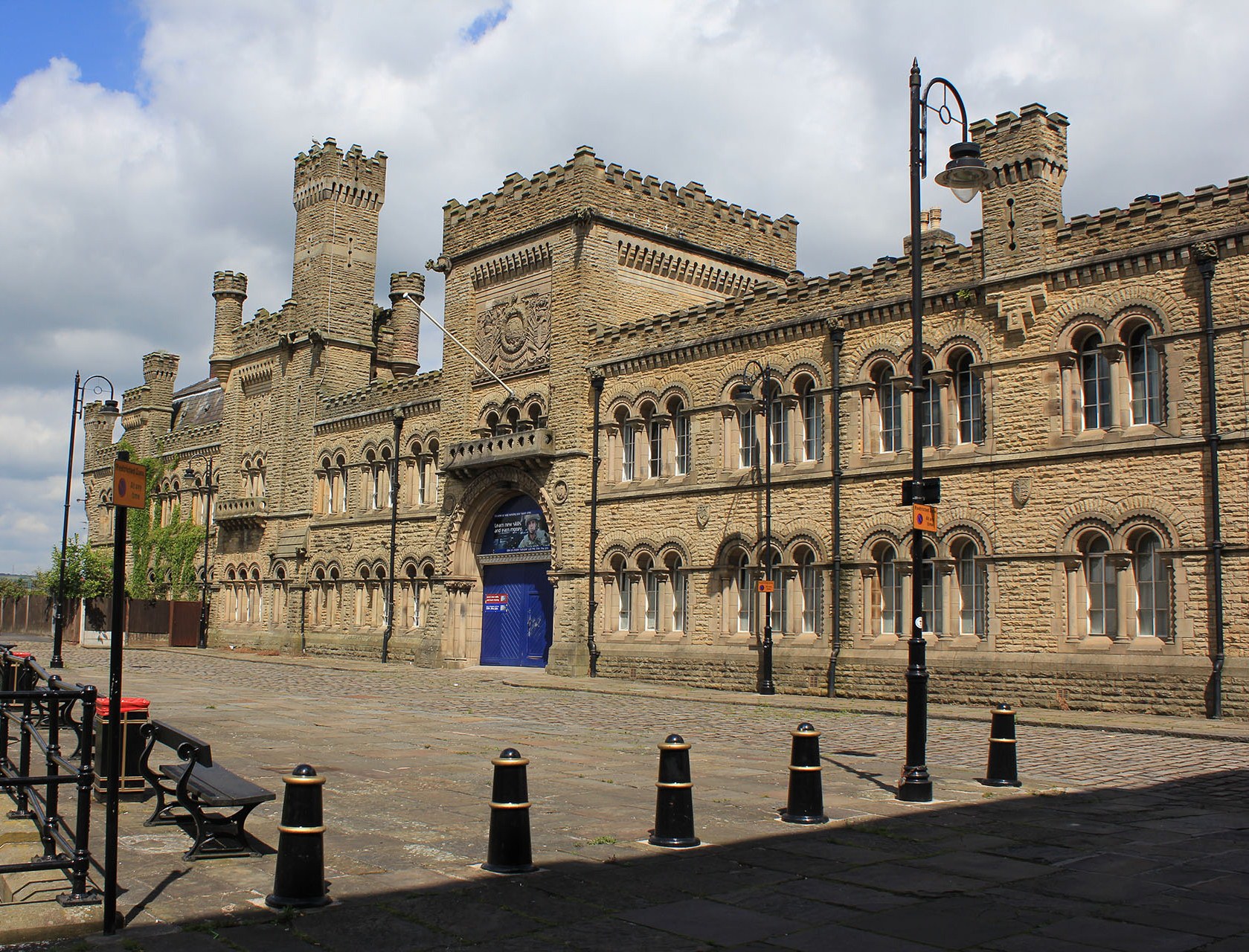 Bury, Castle Street, Drill Hall, 1868, its impressive stone–faced, gothic style frontage with crenulations was designed by Henry Styan and James Farrier, it is Grade II listed.