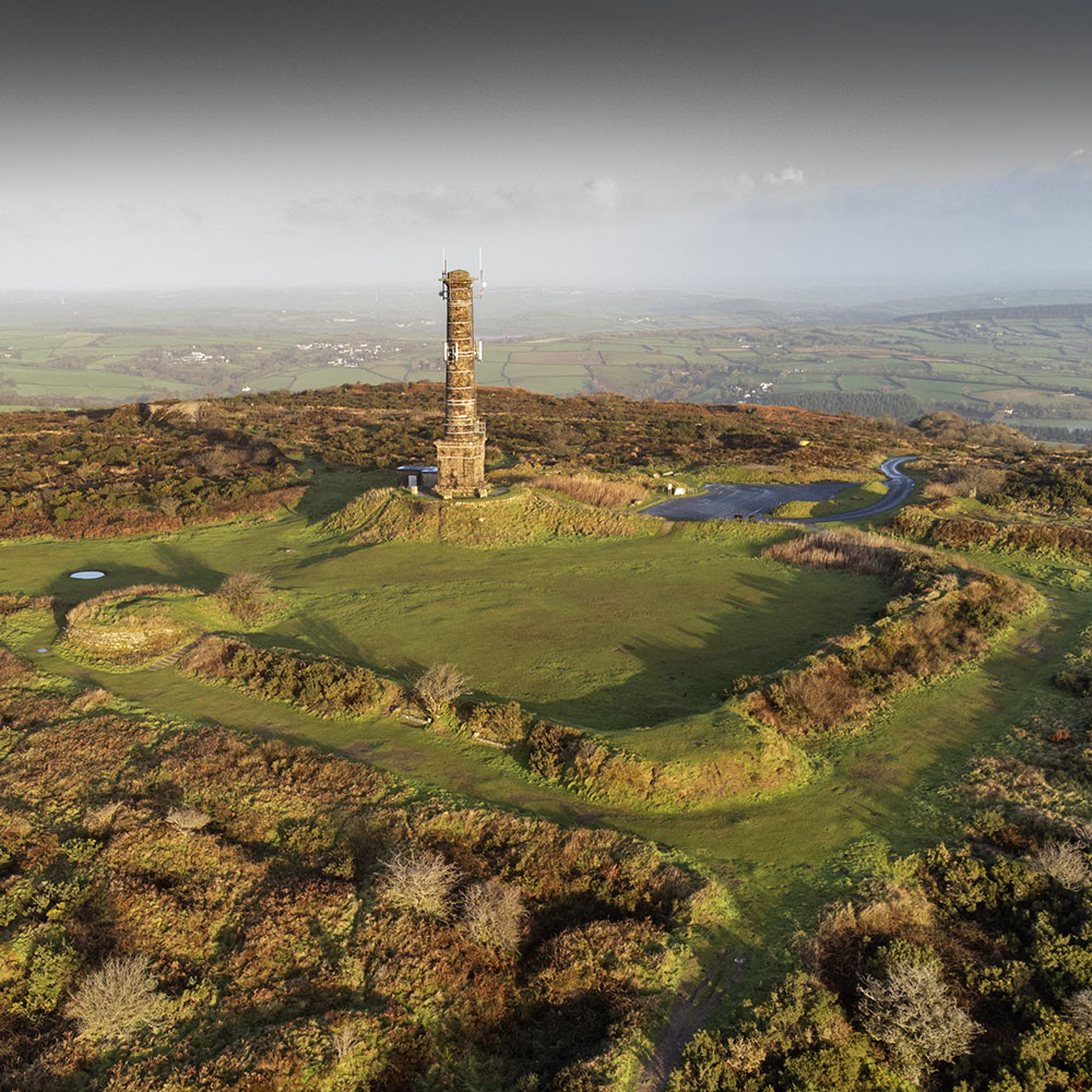 The remains of the Georgian folly at the top of Kit Hill consist of a platform within a roughly-square earthwork with bastions at each corner, designed to represent a castle.