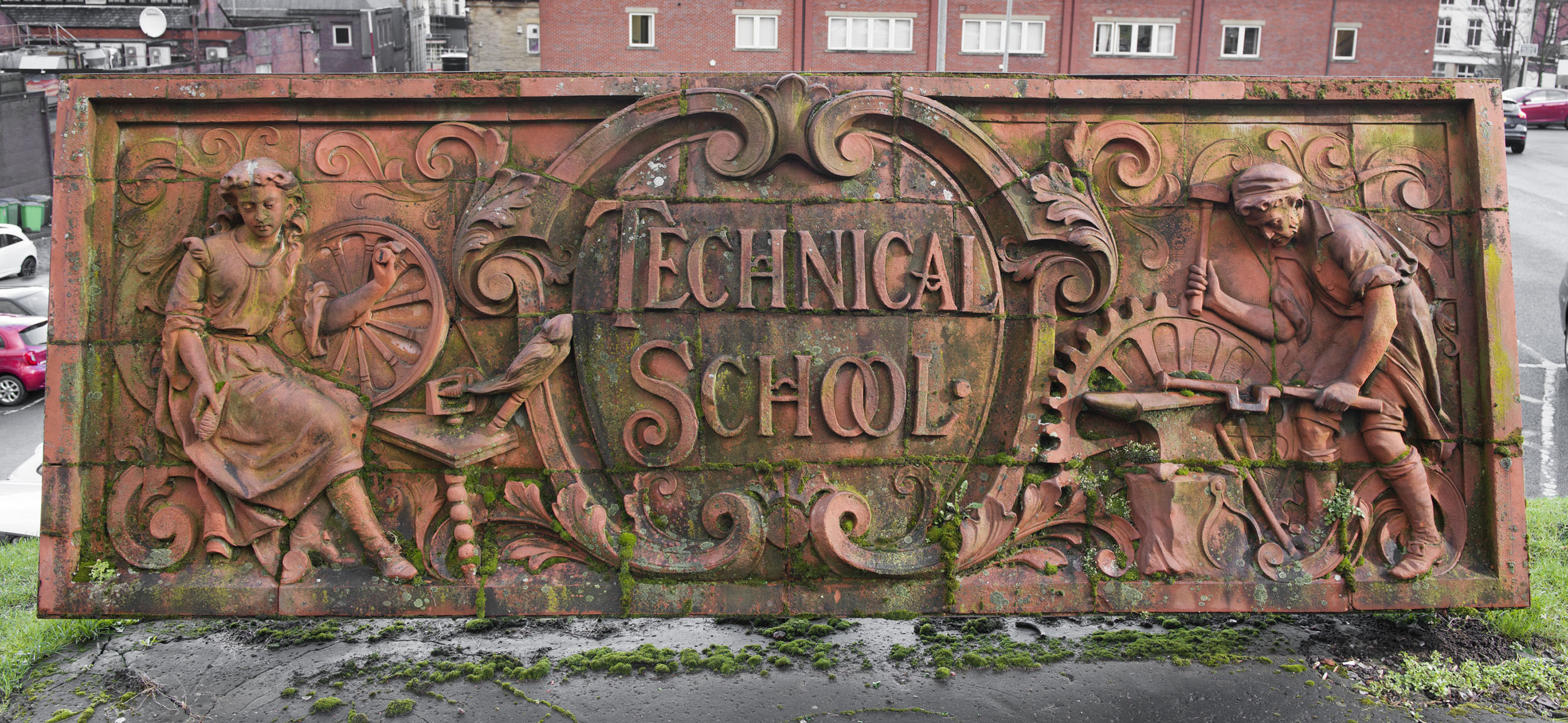 A freestanding panel with two figures and the words 'Technical School'.
