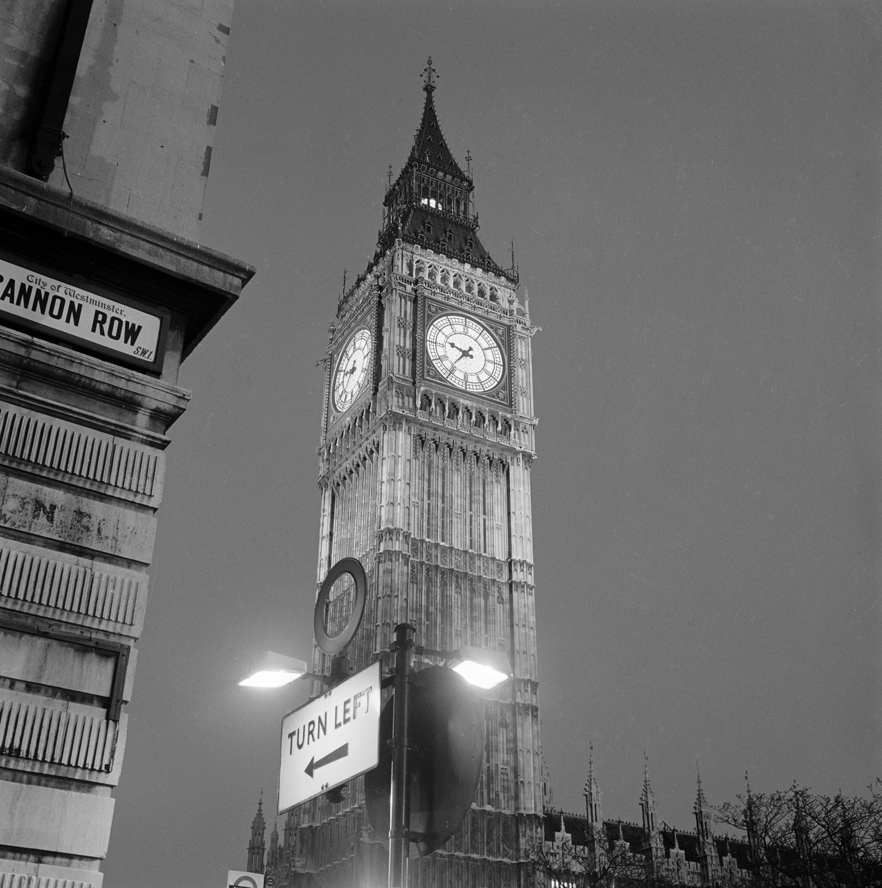 Black and white photo of Big Ben from the corner of Cannon Row