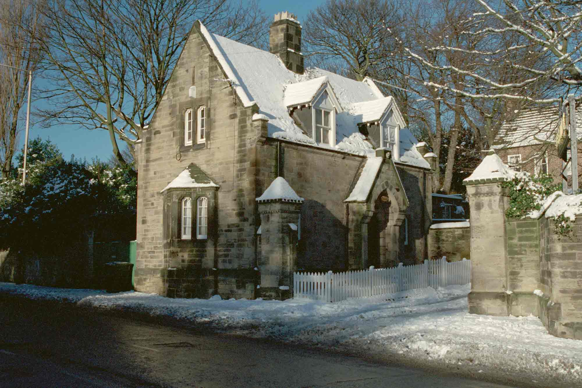 Stone building covered with snow