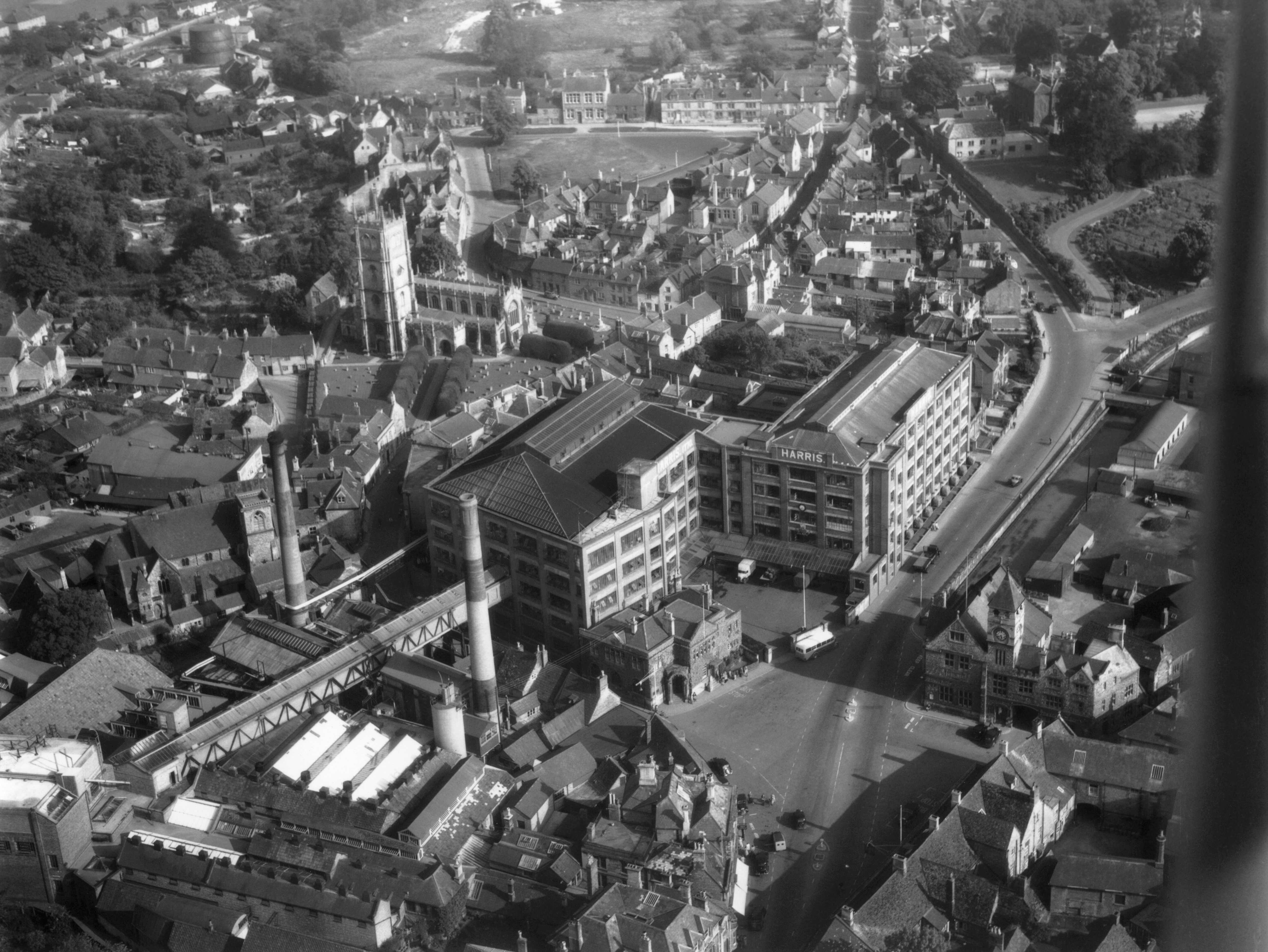 A black and white aerial photograph of a factory building in Calne, Wiltshire.