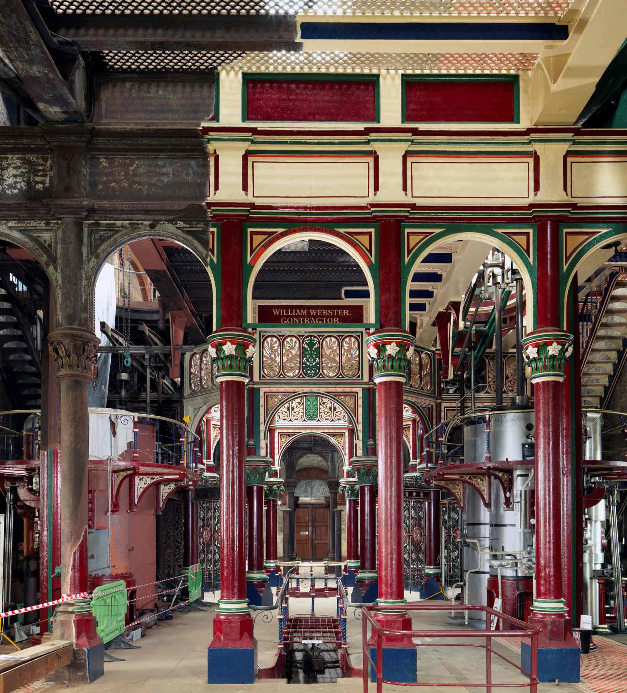 Interior view of the pumping station, looking towards the main atrium space, showing restored and unrestored ironwork