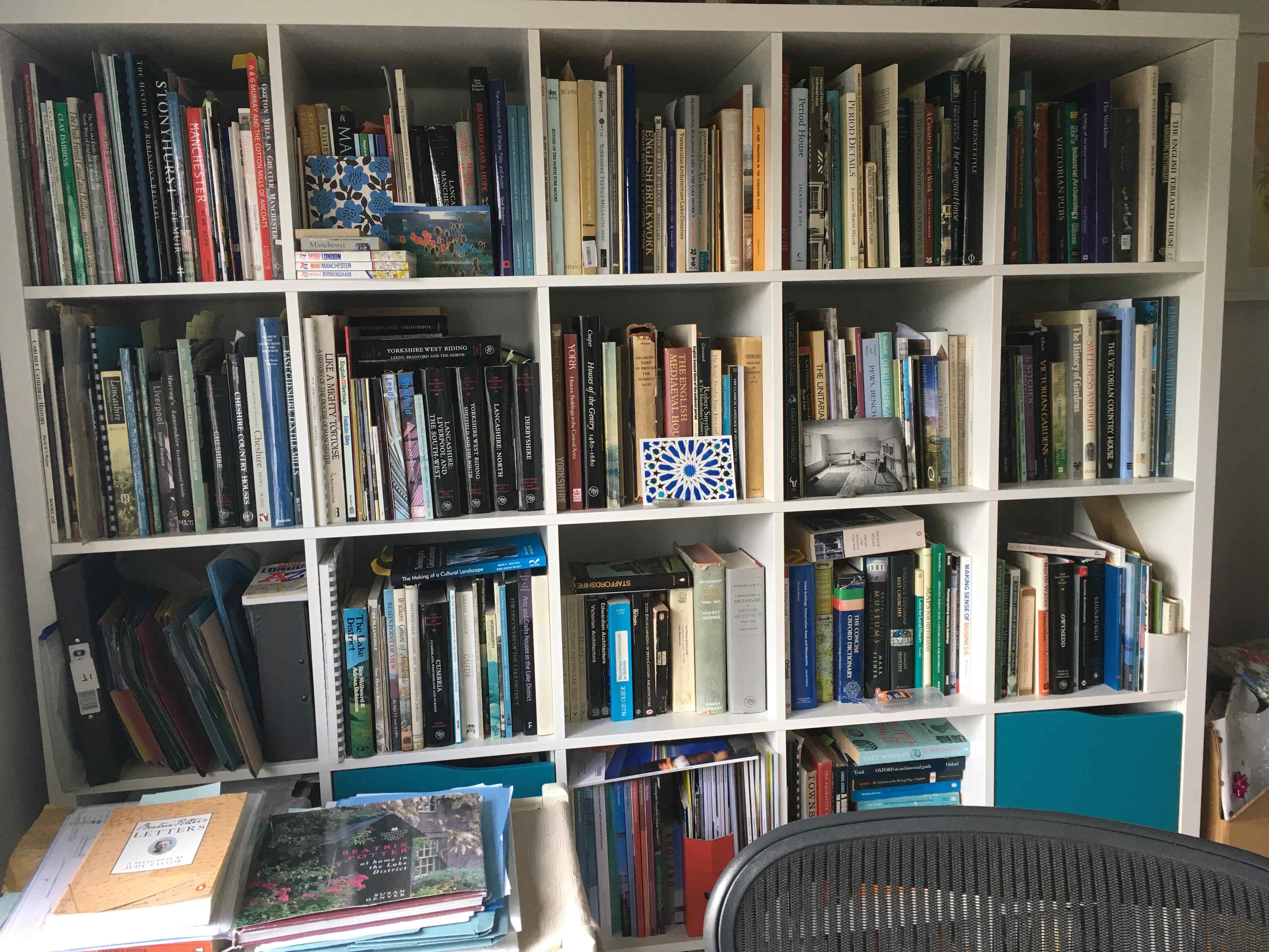 Colour photo of bookcases in a home office.